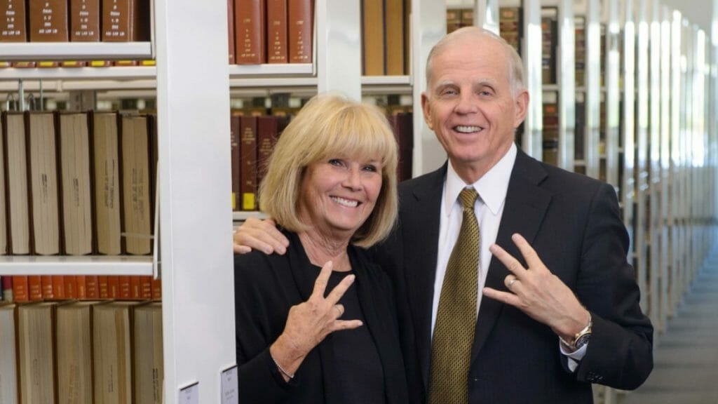 Leo and Annette Beus flashing the ASU Pitchfork sign