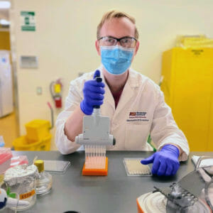 Scientist in lab preparing samples to test